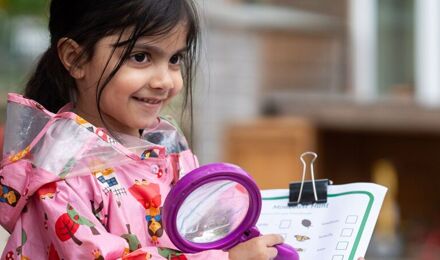 Girl with magnifying glass