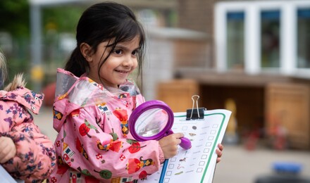 Girl with magnifying glass