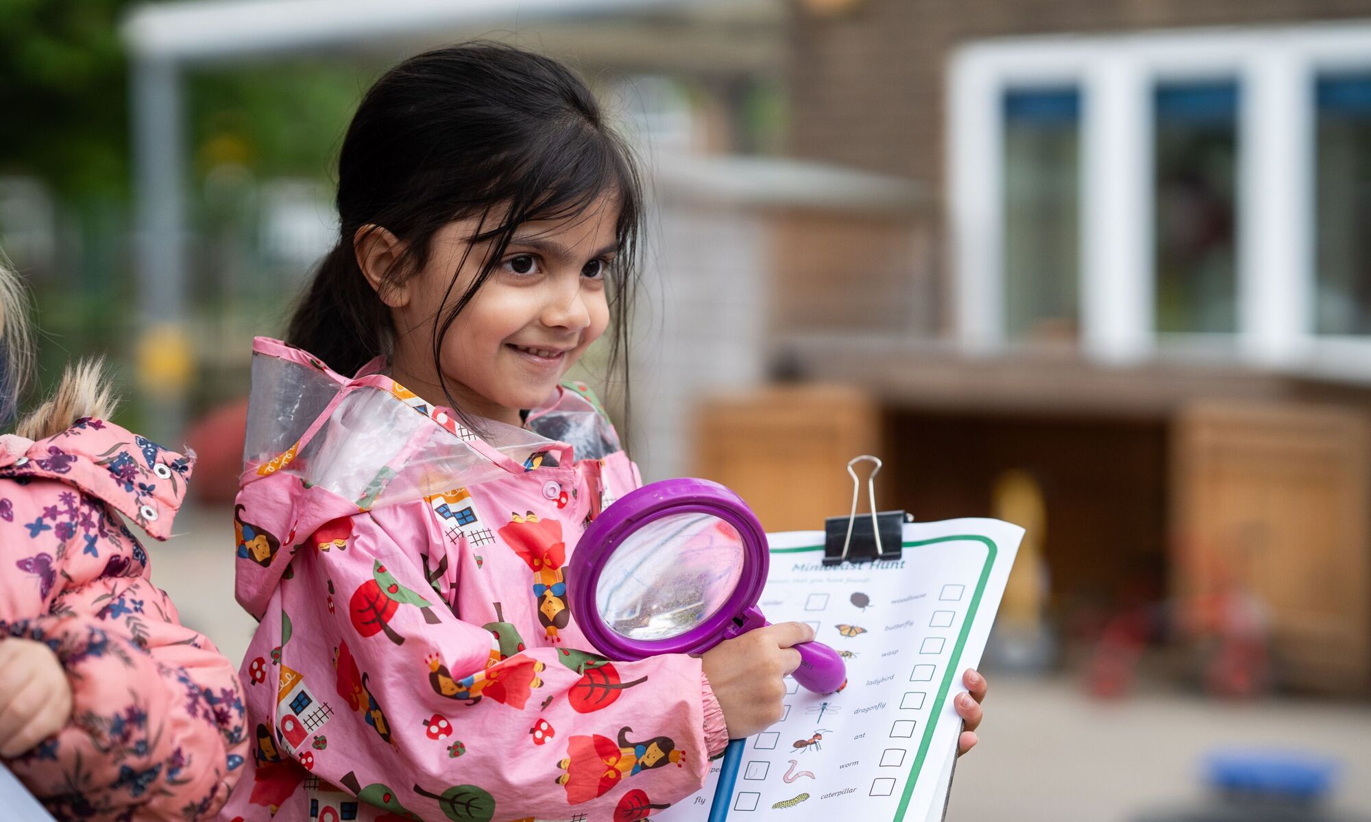 Girl with magnifying glass